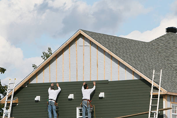 Professional Siding technician working in Harrisburg, NC